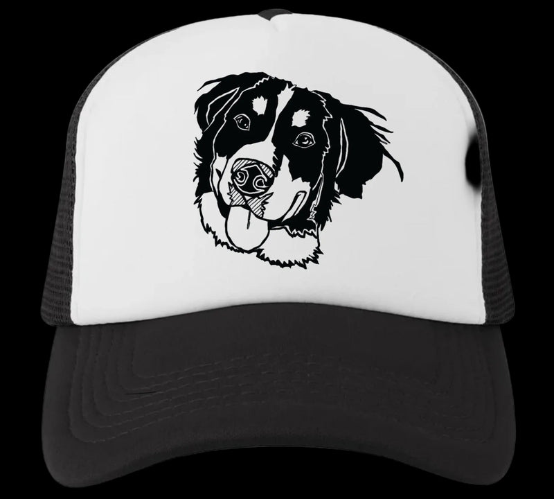 Trucker hat with a black and white dog illustration on a white background